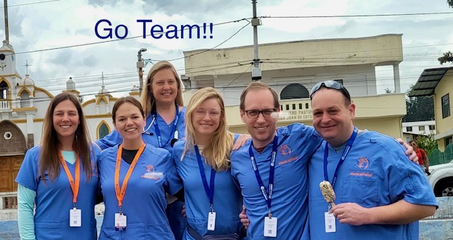 Pine Point Medical volunteers posing together during medical mission trip clinic in Ecuador