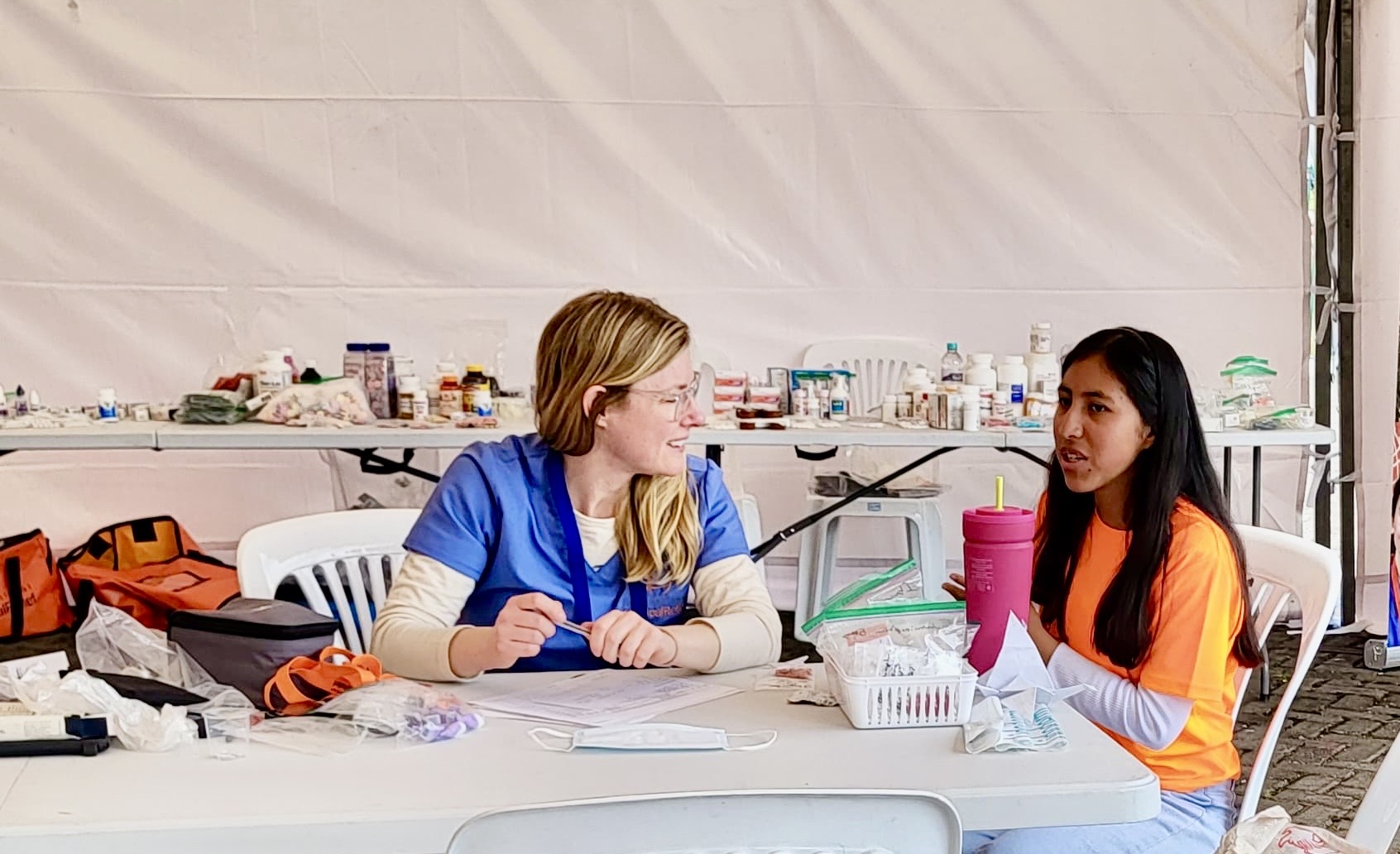Pine Point Medical providers consulting with Ecuadorian patient during community medical clinic