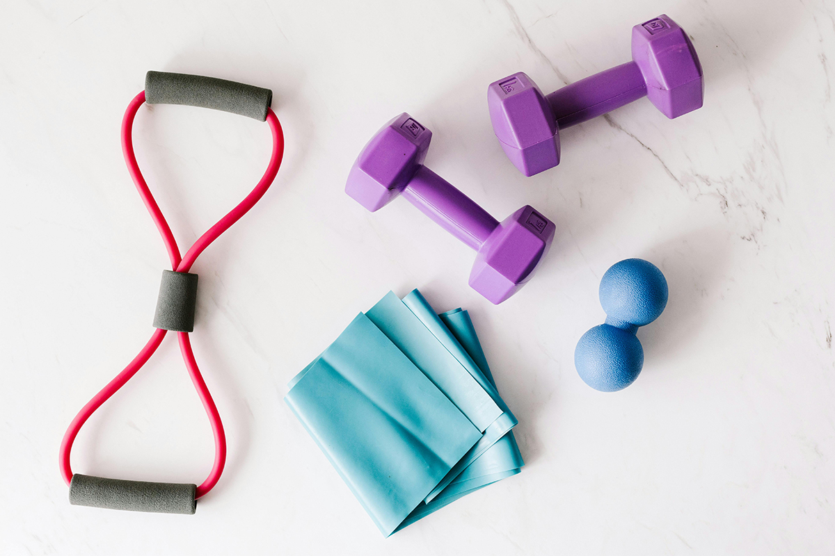 Resistance bands, dumbbells, and exercise equipment used in medically supervised athletic training and strength programs